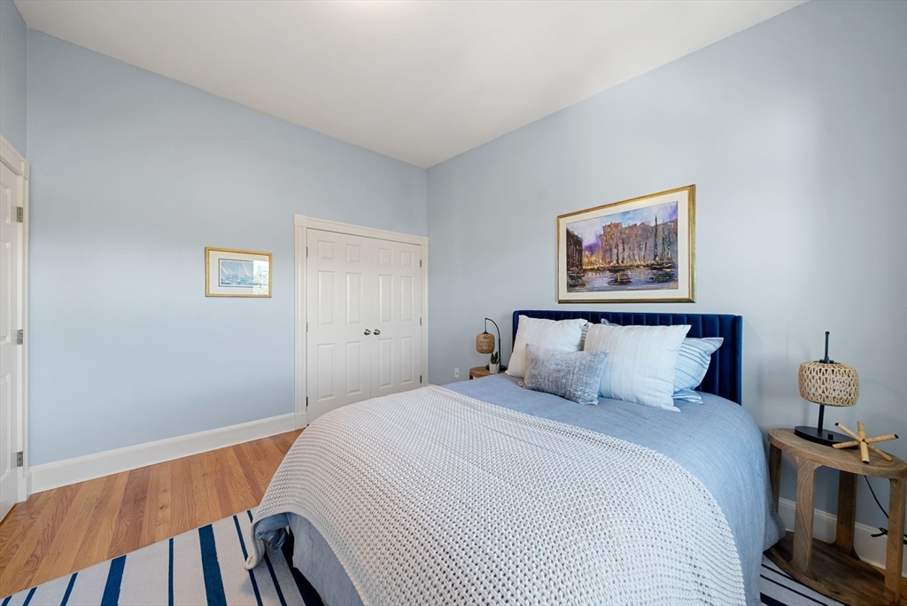 11 Wall Street Boston, MA 02129 - Photo 26 of 33 a bedroom with a bed and a painting on the wall