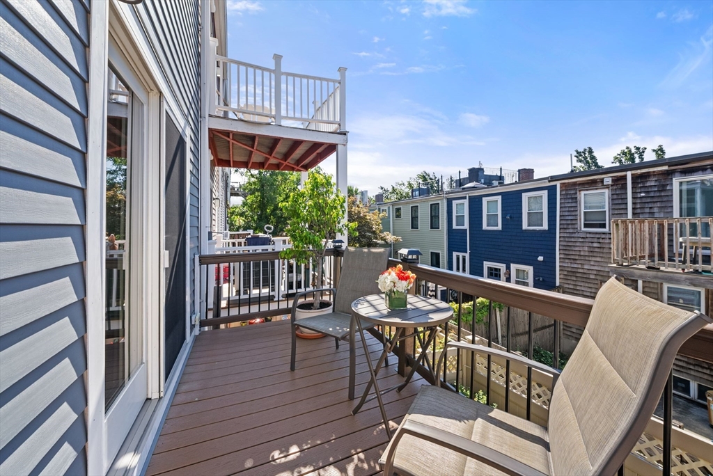 11 Wall Street Boston, MA 02129 - Photo 9 of 33 a view of a balcony with wooden floor and outdoor seating