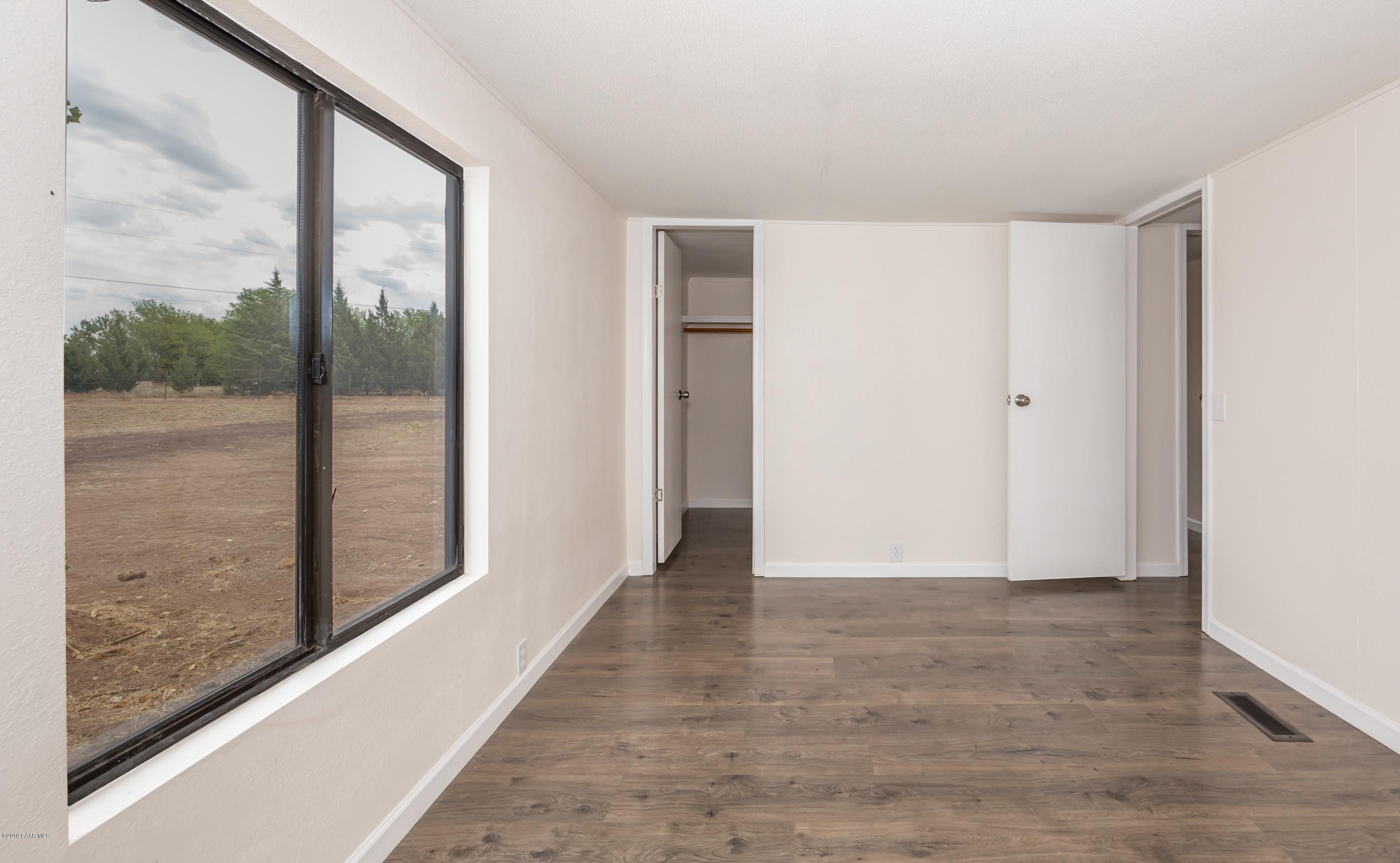 25156 North Stump Road Paulden, AZ 86334 - Photo 13 of 17 a view of hallway with floor to ceiling window