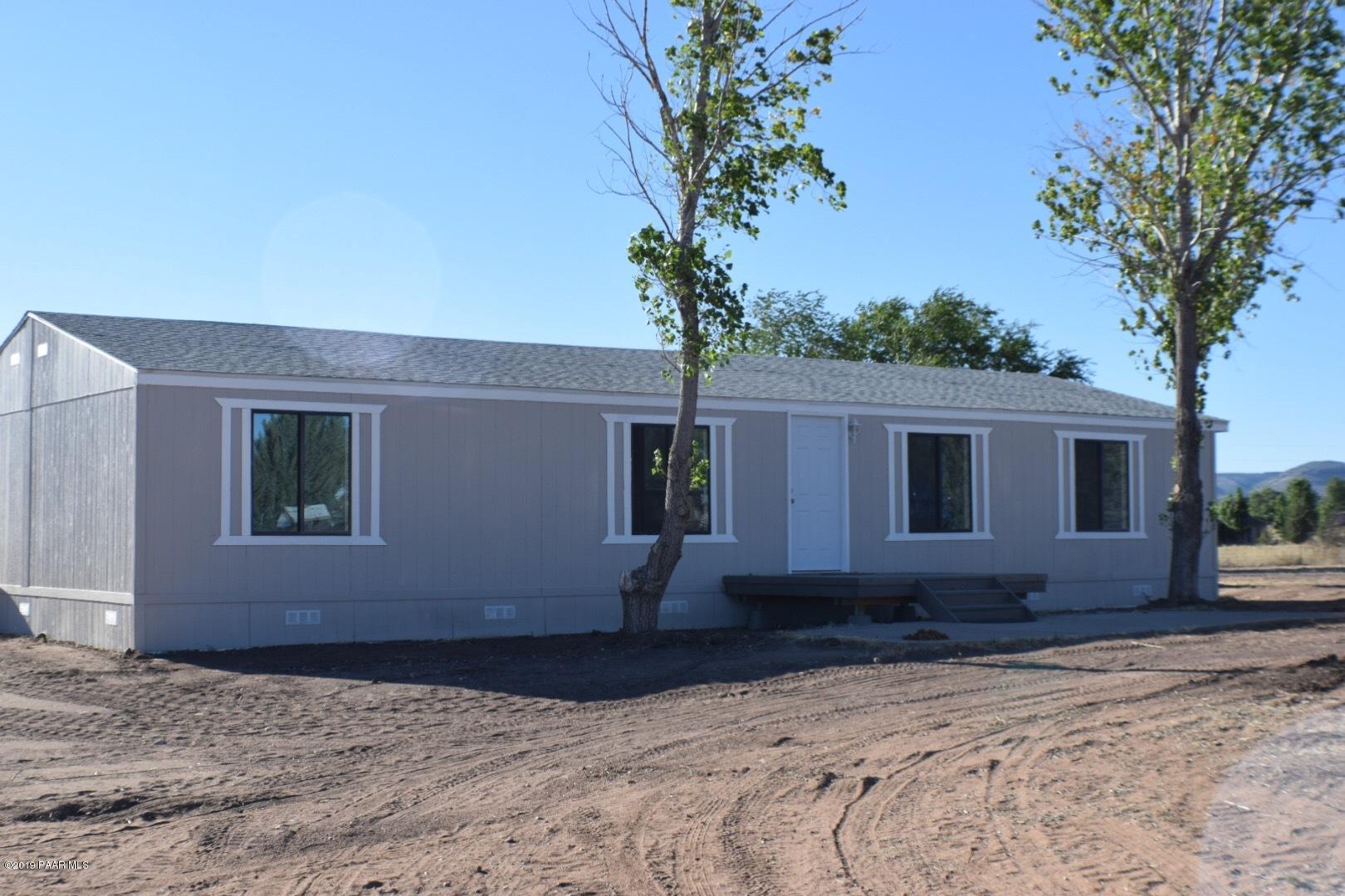 25156 North Stump Road Paulden, AZ 86334 - Photo 2 of 17 a house that has a tree in front of it
