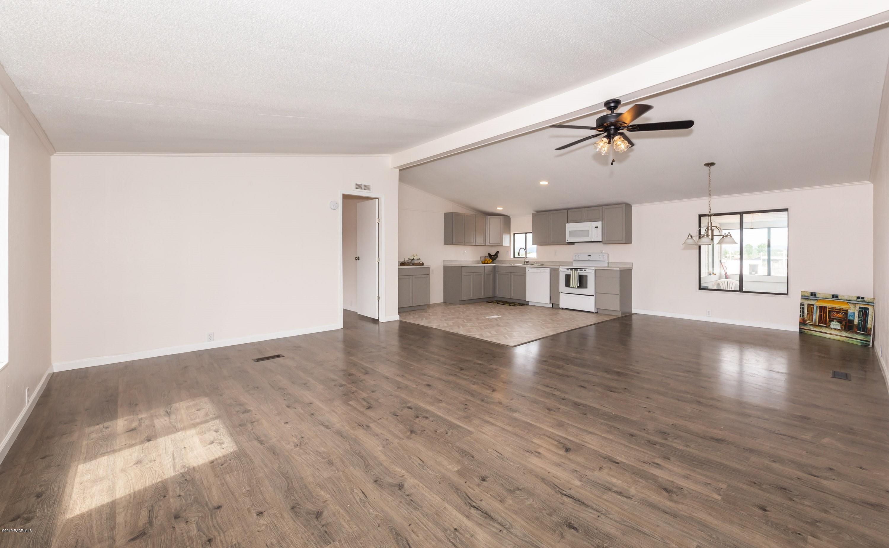 25156 North Stump Road Paulden, AZ 86334 - Photo 5 of 17 a view of a living room a stove and a window