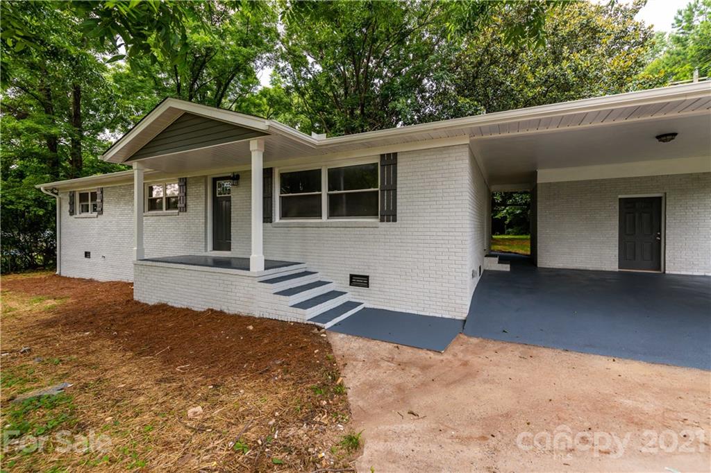 1060 Dunlap Roddey Road Rock Hill, SC 29730 - Photo 2 of 30 a front view of a house with a yard and garage