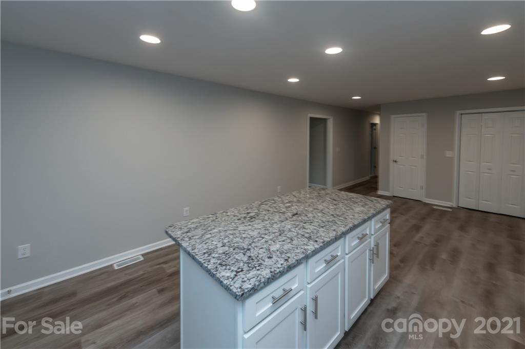 1060 Dunlap Roddey Road Rock Hill, SC 29730 - Photo 13 of 30 a kitchen with a sink and chandelier