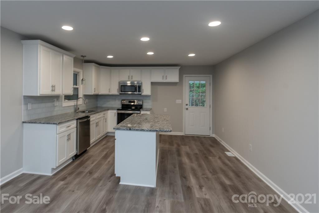 1060 Dunlap Roddey Road Rock Hill, SC 29730 - Photo 15 of 30 a kitchen with a sink window and cabinets