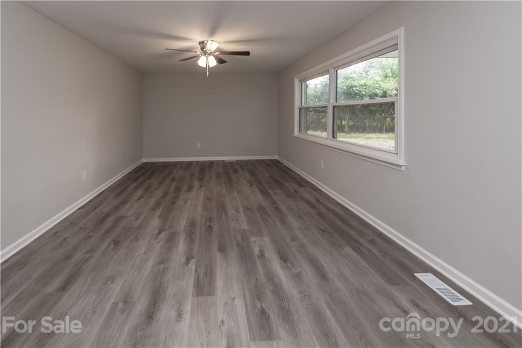 1060 Dunlap Roddey Road Rock Hill, SC 29730 - Photo 6 of 30 wooden floor in an empty room with a window