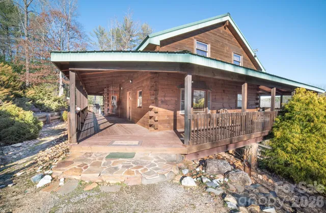 a kitchen with stainless steel appliances kitchen island granite countertop a table and chairs