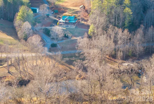 a view of dirt yard with a tree