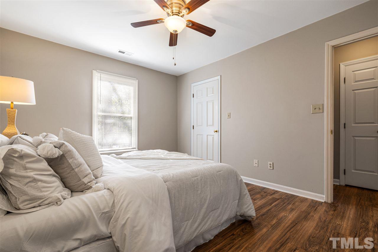 6404 Fox Road Raleigh, NC 27616 - Photo 22 of 25 a bedroom with a bed and a window