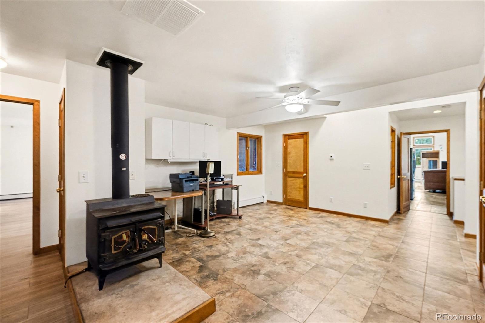 6094 Pyrenees Trail Golden, CO 80403 - Photo 6 of 24 a view of a livingroom with furniture and a ceiling fan