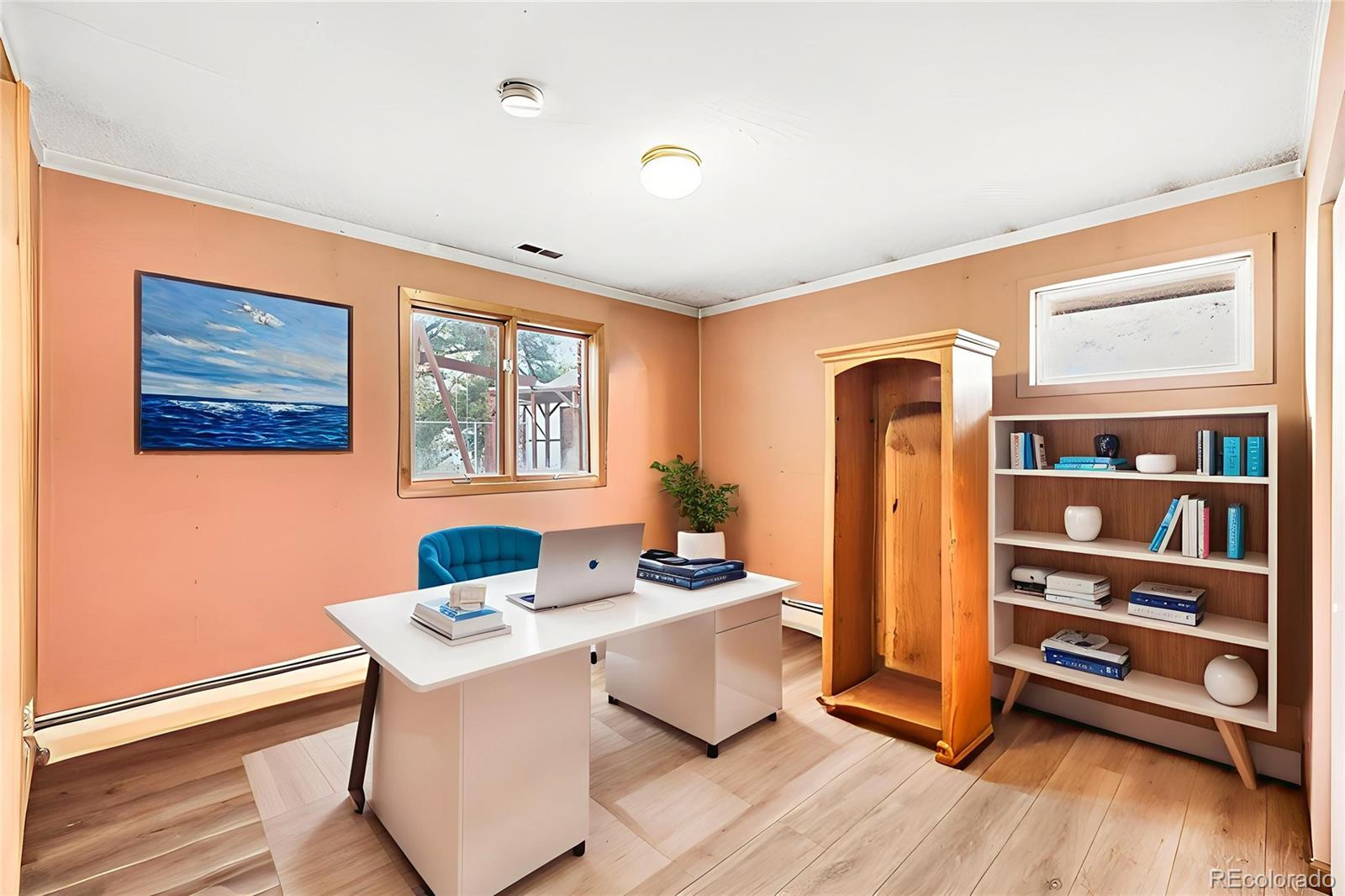 6094 Pyrenees Trail Golden, CO 80403 - Photo 8 of 24 a workspace with furniture window and wooden floor