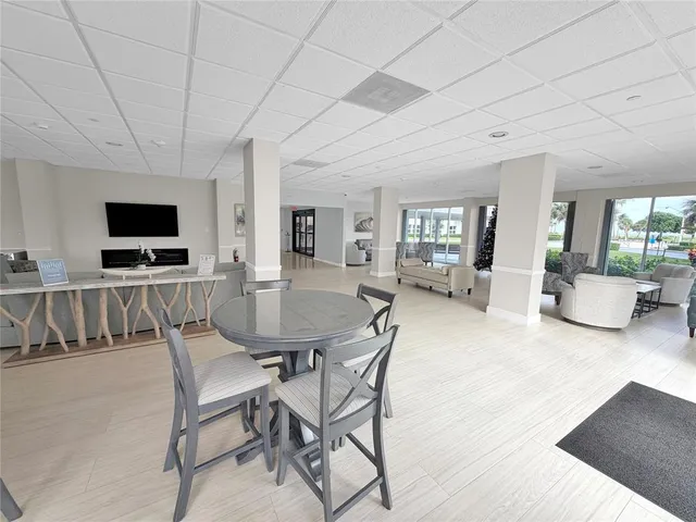 a view of a livingroom with furniture and a flat screen tv