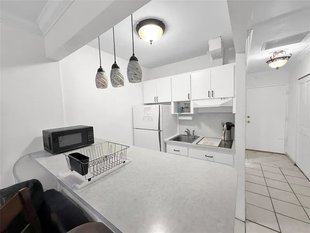 a bathroom with a sink and a shower
