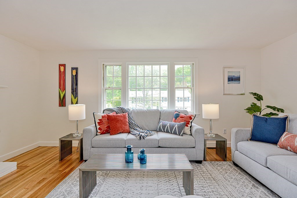 105 Booth Road Dedham, MA 02026 - Photo 11 of 39 a living room with furniture and a potted plant on a table