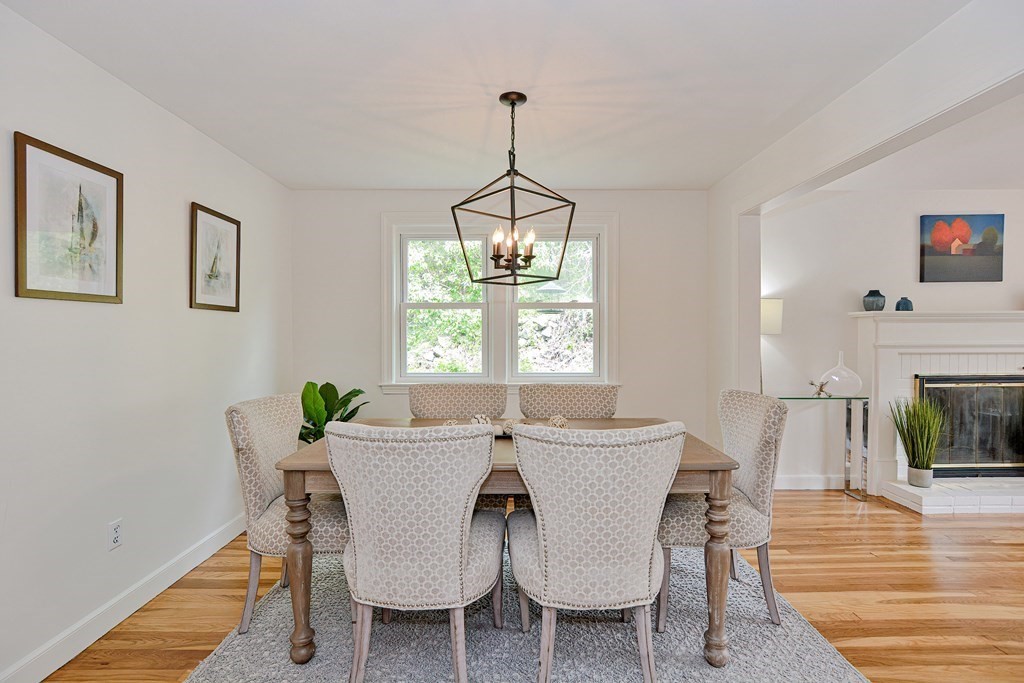 105 Booth Road Dedham, MA 02026 - Photo 17 of 39 a view of a dining room with furniture window and wooden floor
