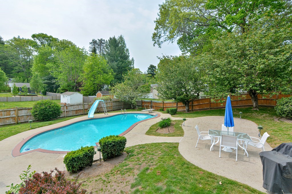 105 Booth Road Dedham, MA 02026 - Photo 36 of 39 a view of a swimming pool with a patio