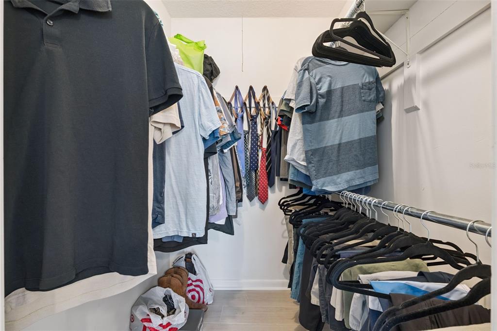 525 South Conway Road, Unit 202 Orlando, FL 32807 - Photo 16 of 34 a view of walk in closet with clothes