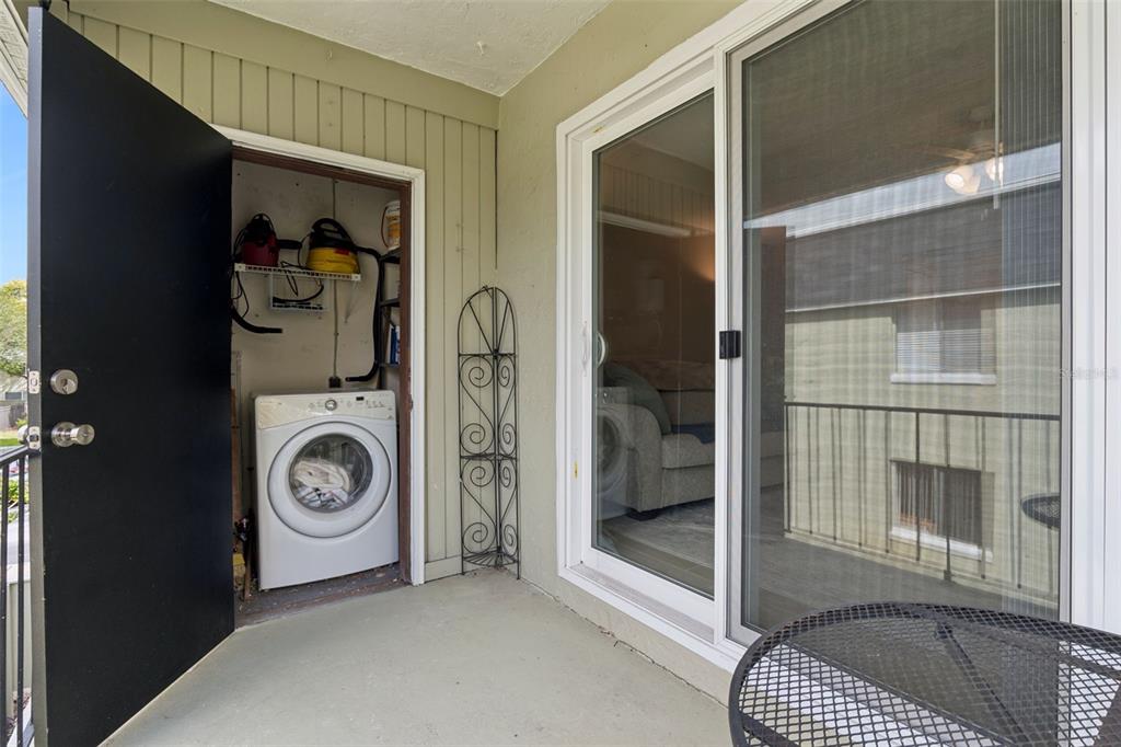 525 South Conway Road, Unit 202 Orlando, FL 32807 - Photo 21 of 34 a view of a storage & utility room with washer and dryer