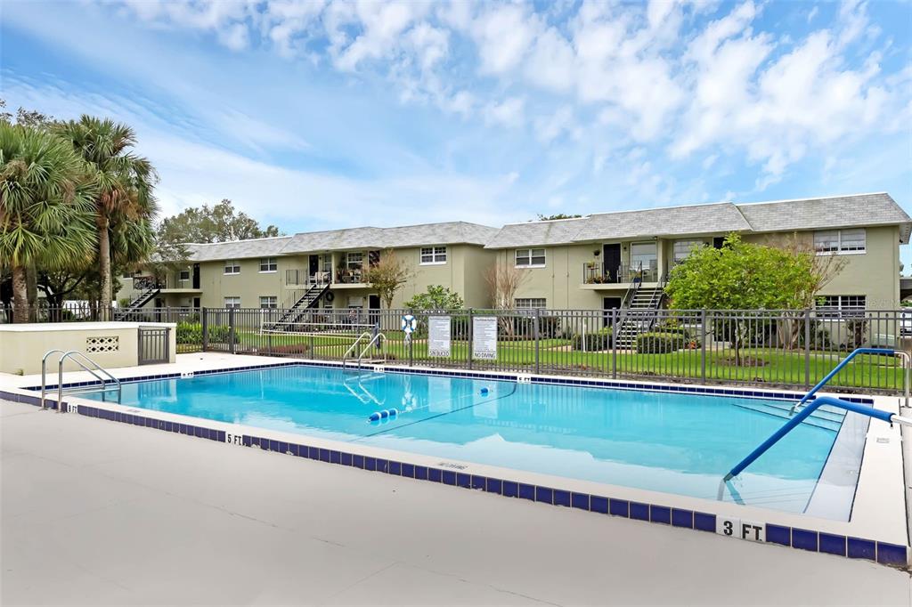 525 South Conway Road, Unit 202 Orlando, FL 32807 - Photo 26 of 34 a view of swimming pool with outdoor seating and yard in the back