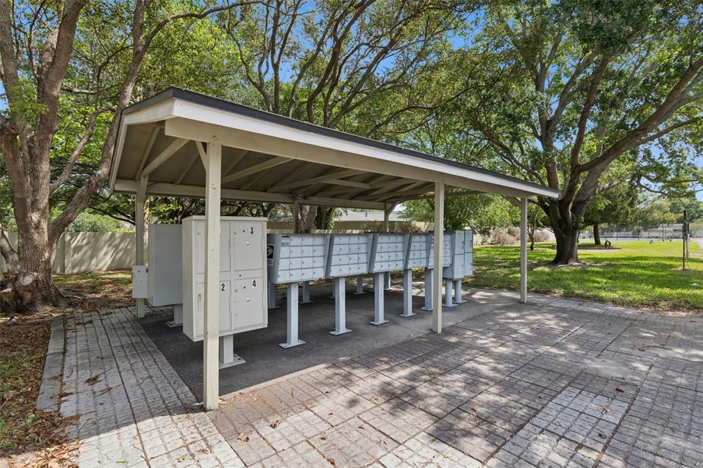 525 South Conway Road, Unit 202 Orlando, FL 32807 - Photo 30 of 34 a view of a chair and table in backyard of the house
