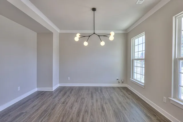 a view of an entryway with wooden floor and stairs