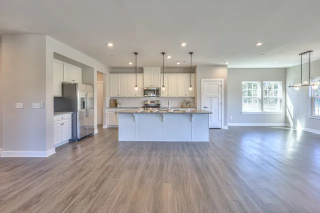 a view of a kitchen and dining room