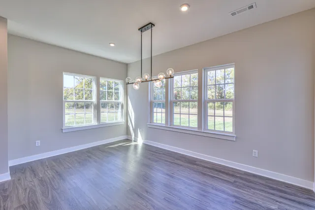 an empty room with windows