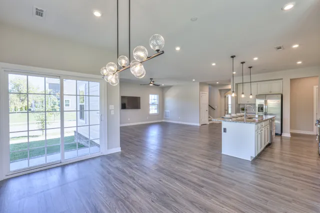 a view of an empty room and closet area