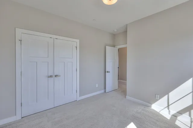 a bedroom with a bed and a table