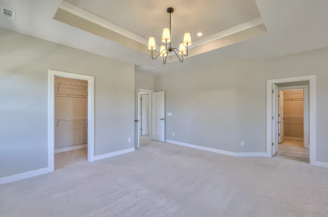 a bathroom with a shower and a glass door