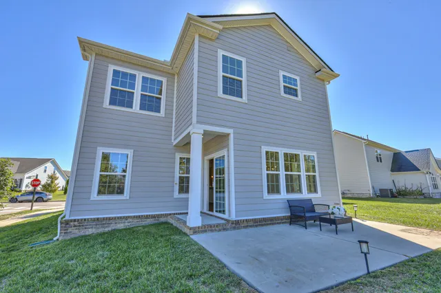 an aerial view of house with yard swimming pool and outdoor seating
