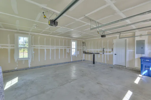 a aerial view of a house with a yard balcony and outdoor seating