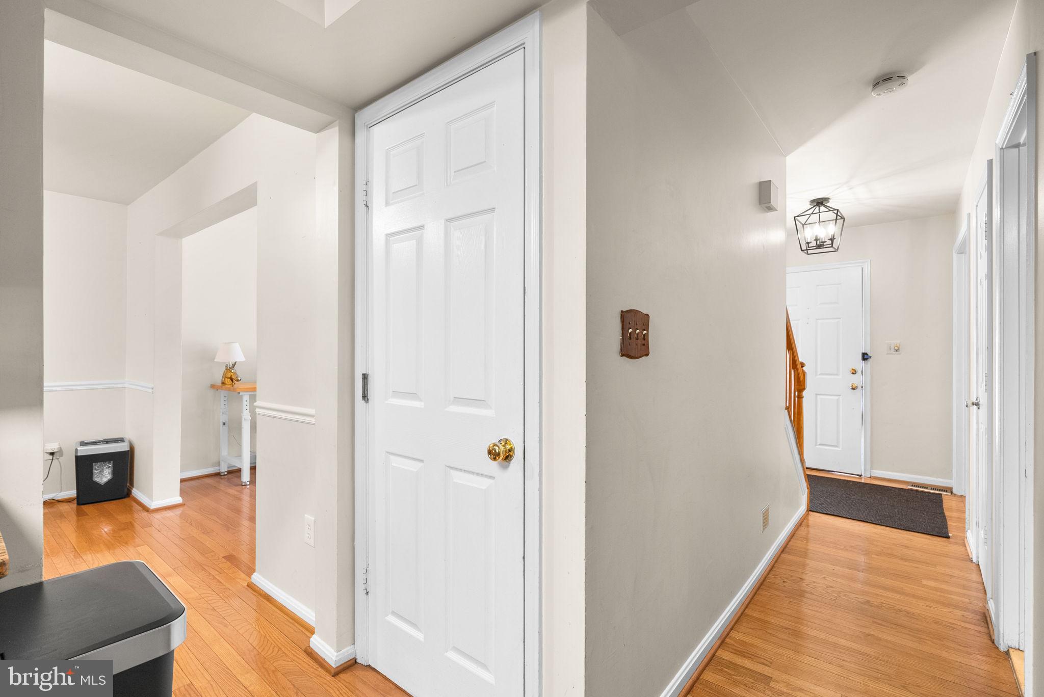 2914 Hatboro Place Upper Marlboro, MD 20772 - Photo 16 of 42 a view of a livingroom with wooden floor and a chandelier