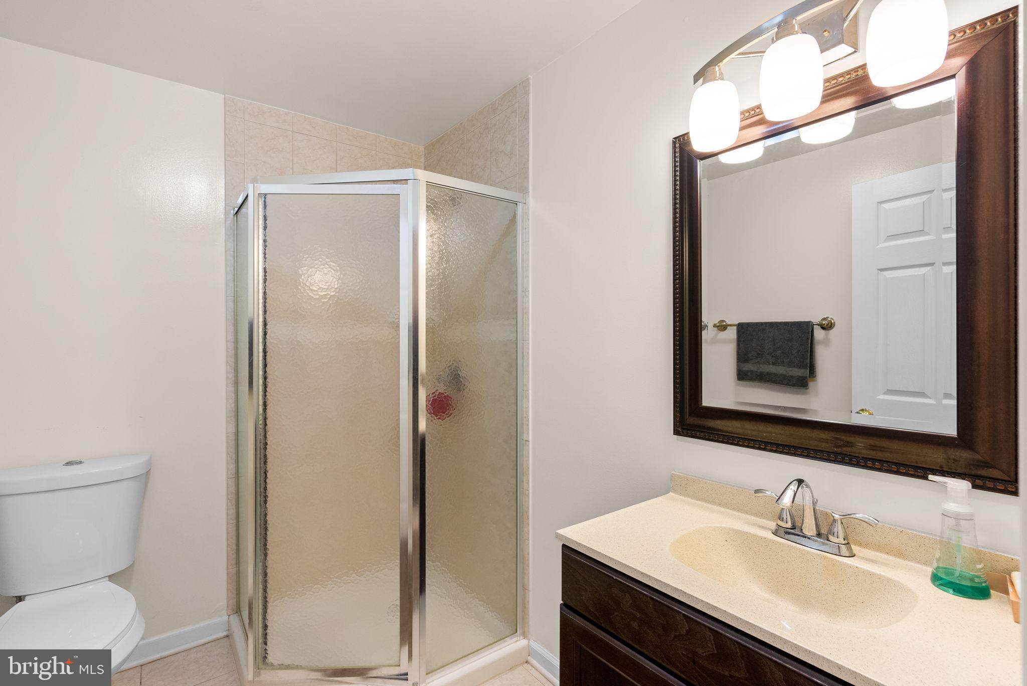 2914 Hatboro Place Upper Marlboro, MD 20772 - Photo 33 of 42 a bathroom with a sink toilet and mirror