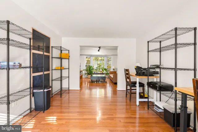 a dining room with furniture a rug and wooden floor