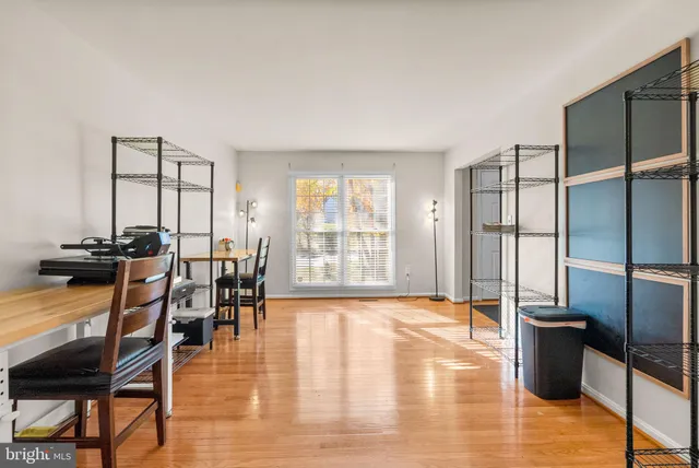 a view of a livingroom with furniture window and wooden floor