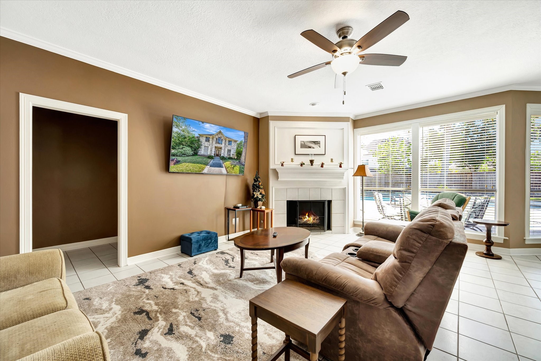 14934 Wilderness Cliff Court Houston, TX 77062 - Photo 14 of 50 a living room with furniture a fireplace and a large window