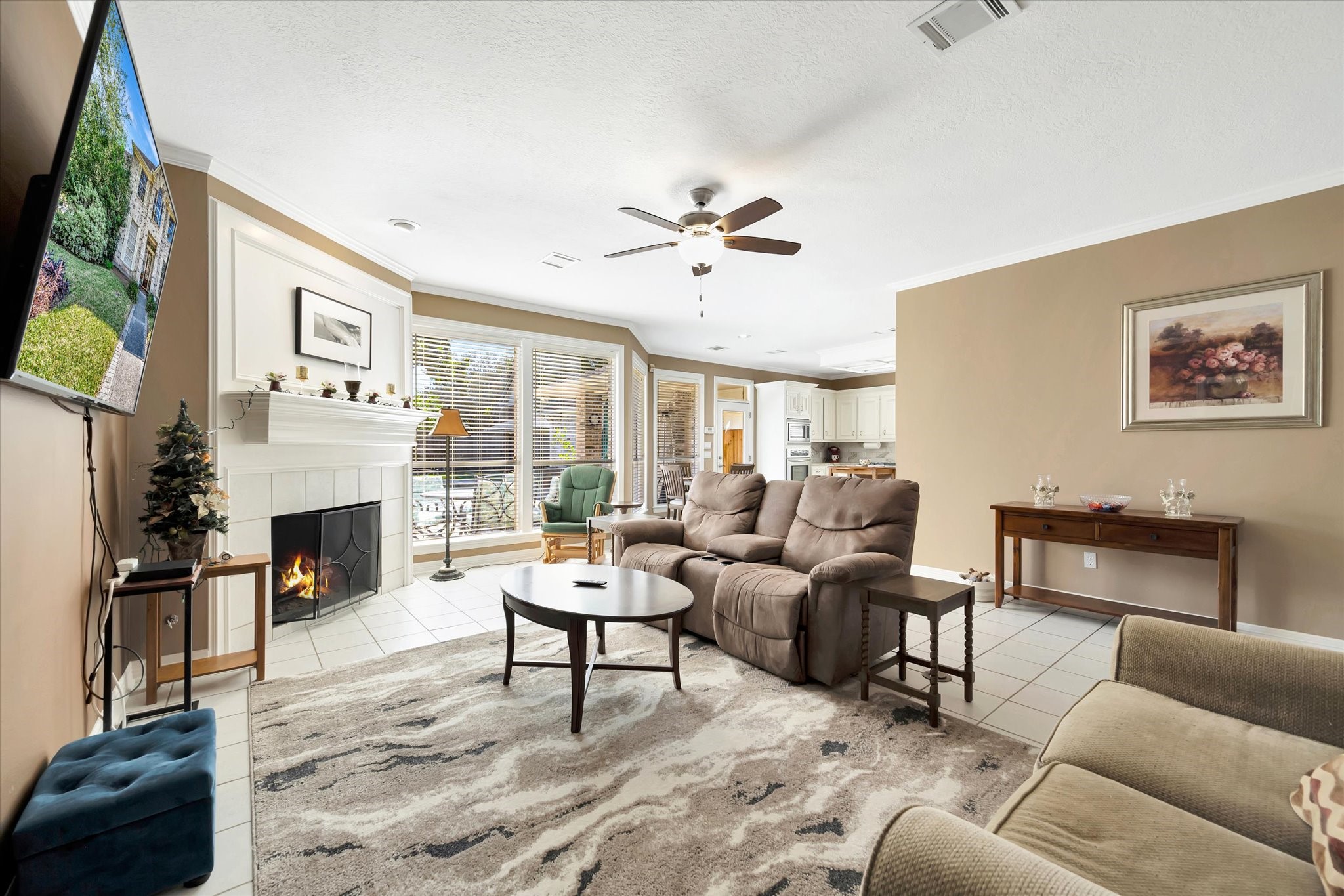 14934 Wilderness Cliff Court Houston, TX 77062 - Photo 15 of 50 a living room with furniture a fireplace and a flat screen tv