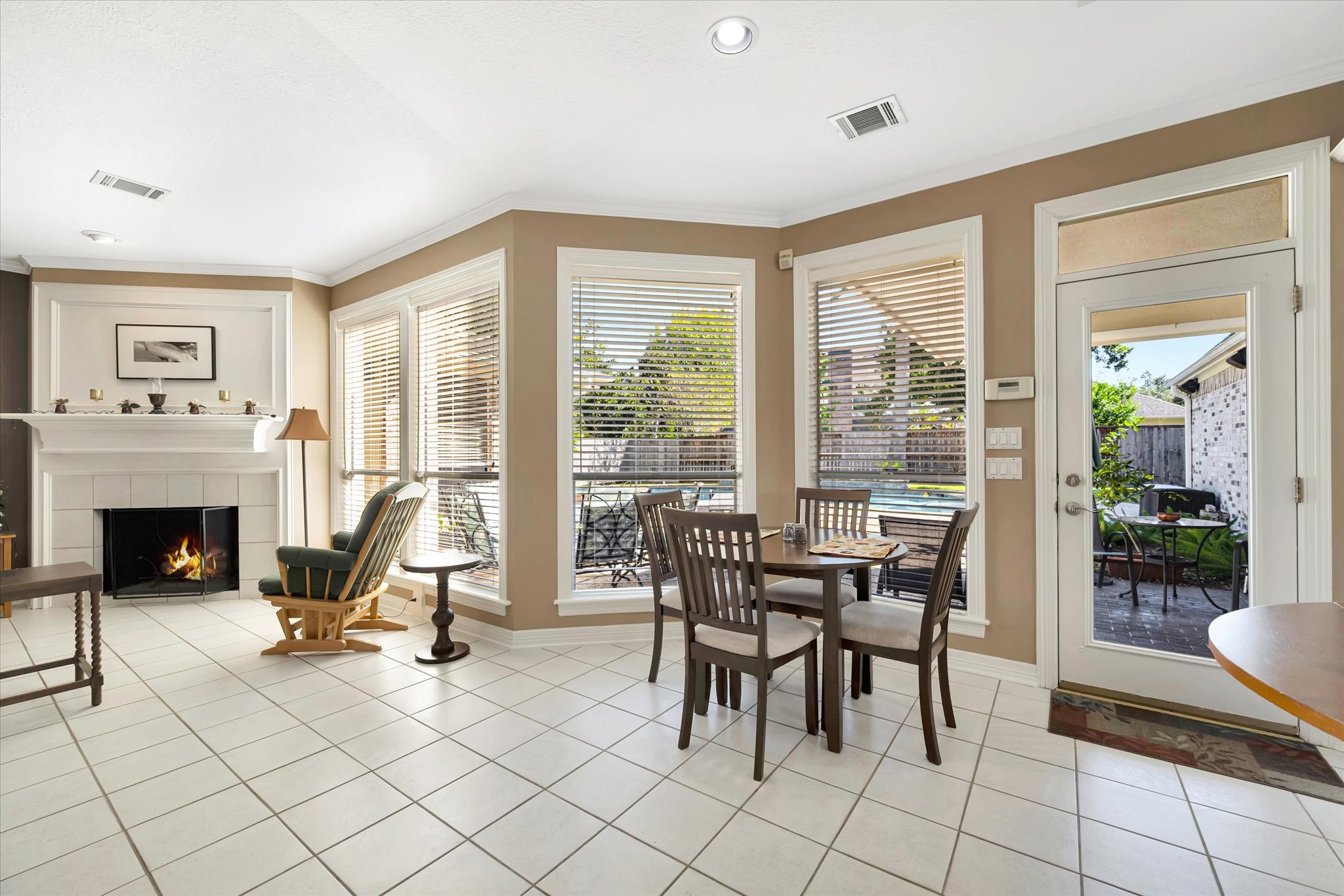 14934 Wilderness Cliff Court Houston, TX 77062 - Photo 18 of 50 a view of a livingroom with furniture a fireplace and large windows