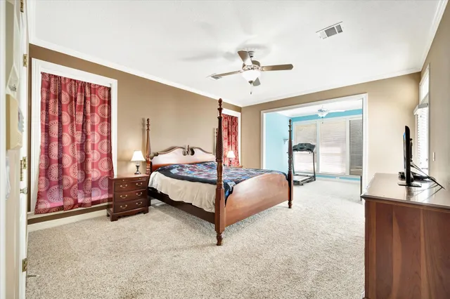 a bed room with a bed and a chandelier