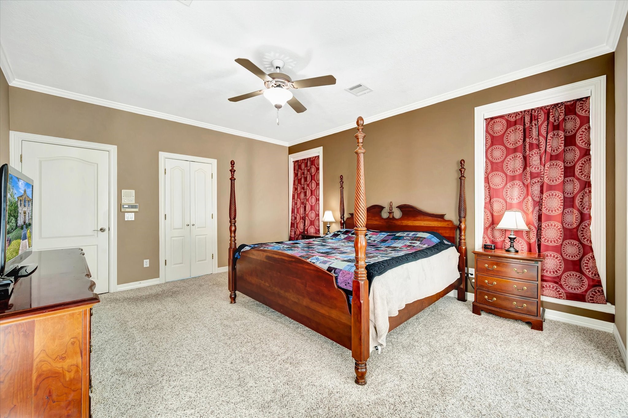 14934 Wilderness Cliff Court Houston, TX 77062 - Photo 29 of 50 a bedroom with a bed and a chandelier
