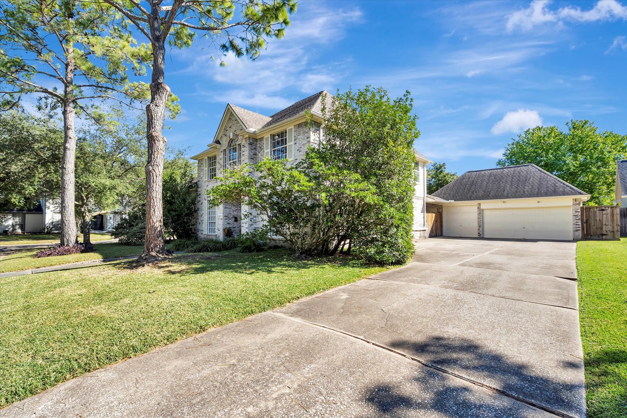 14934 Wilderness Cliff Court Houston, TX 77062 - Photo 3 of 50 a front view of a house with a yard
