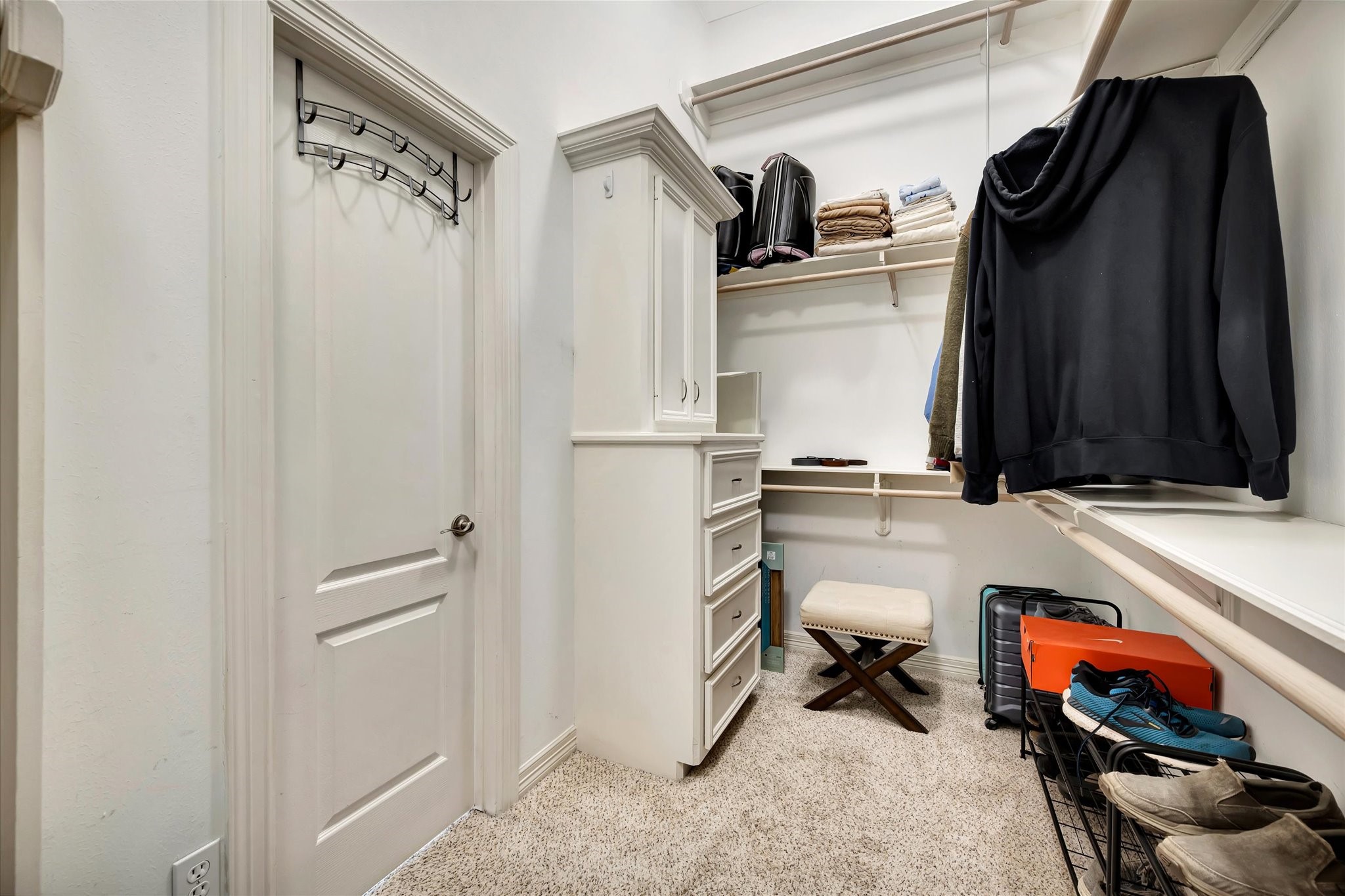 14934 Wilderness Cliff Court Houston, TX 77062 - Photo 34 of 50 a view of walk in closet with clothes and shoes