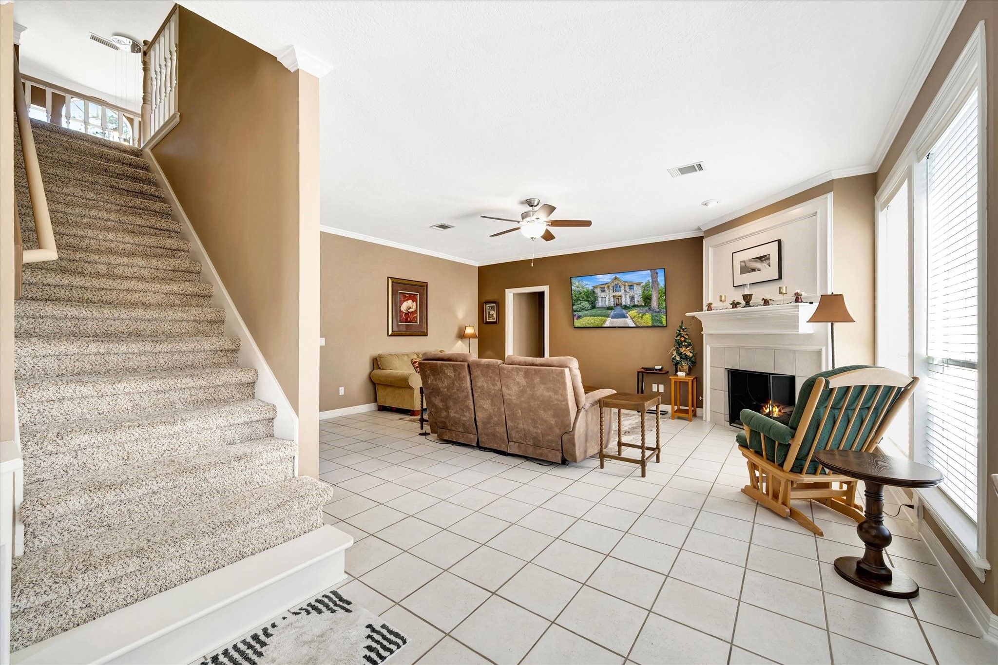14934 Wilderness Cliff Court Houston, TX 77062 - Photo 35 of 50 a living room with furniture and a fireplace