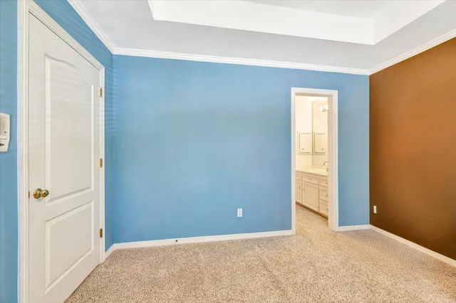 a view of an empty room with windows