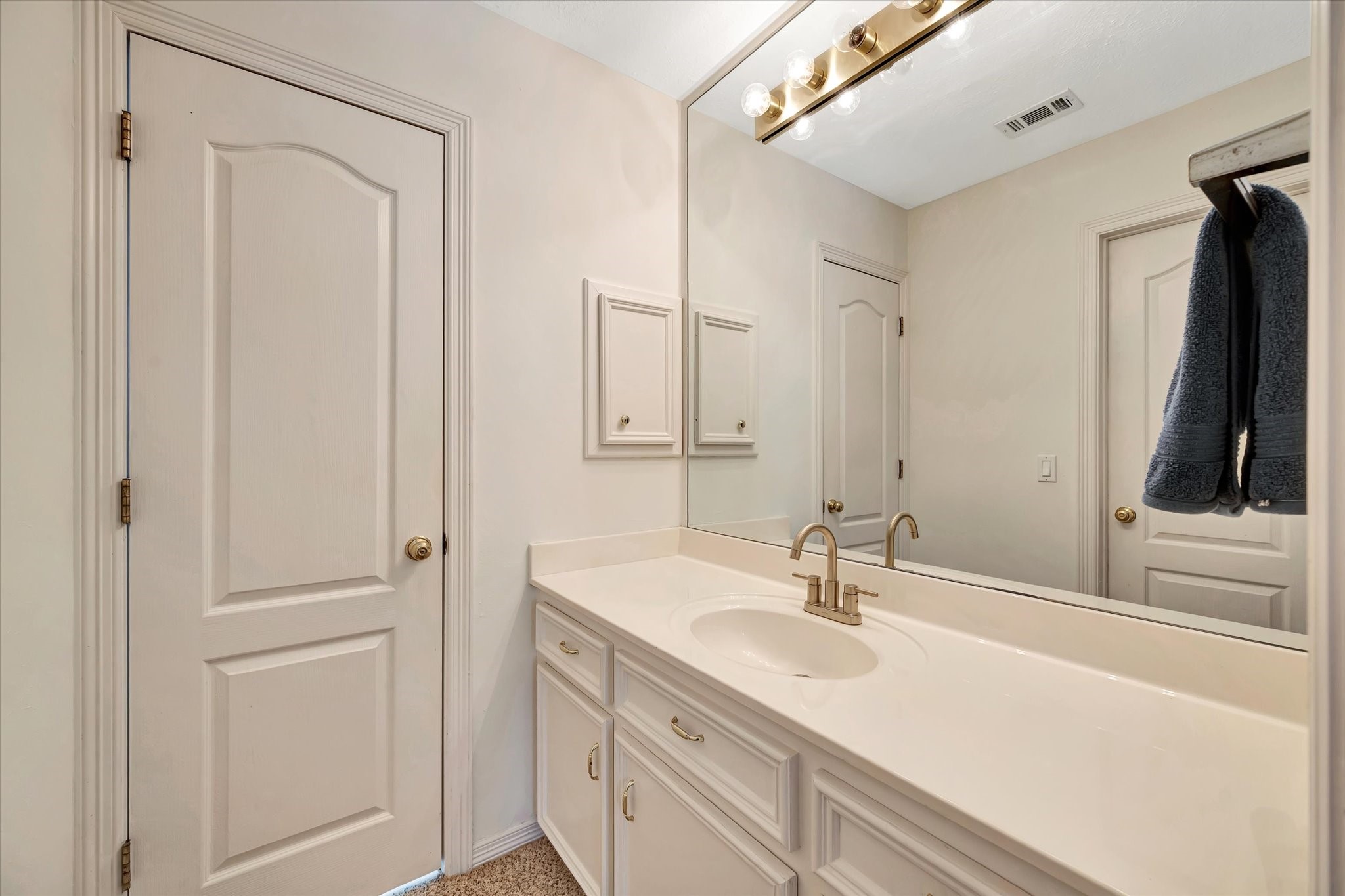 14934 Wilderness Cliff Court Houston, TX 77062 - Photo 41 of 50 a bathroom with a sink and a mirror