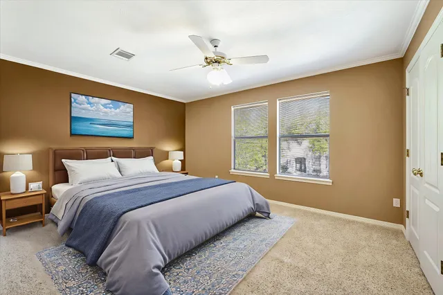 a bedroom with a large bed and a window