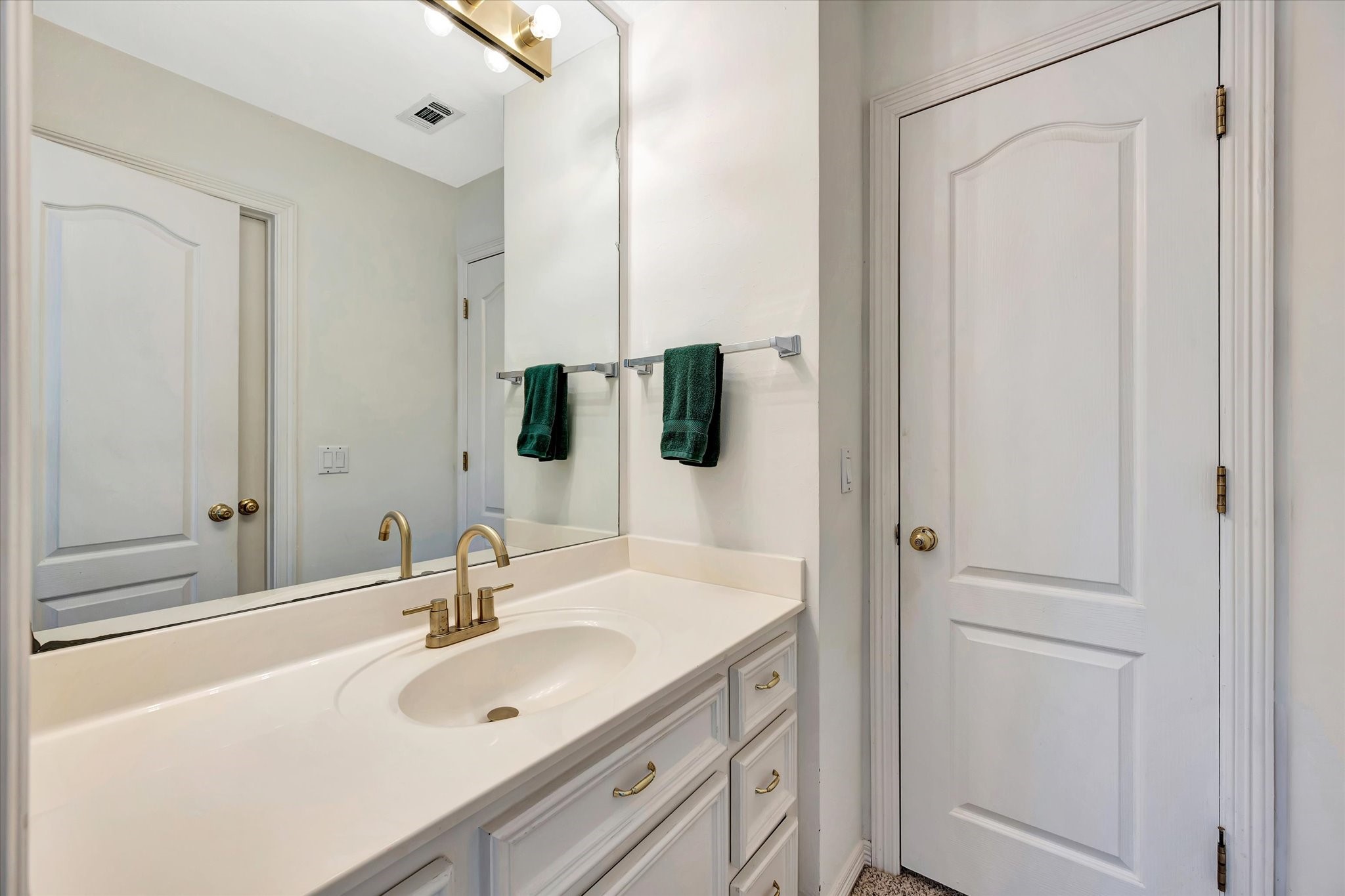 14934 Wilderness Cliff Court Houston, TX 77062 - Photo 48 of 50 a bathroom with a sink and a mirror