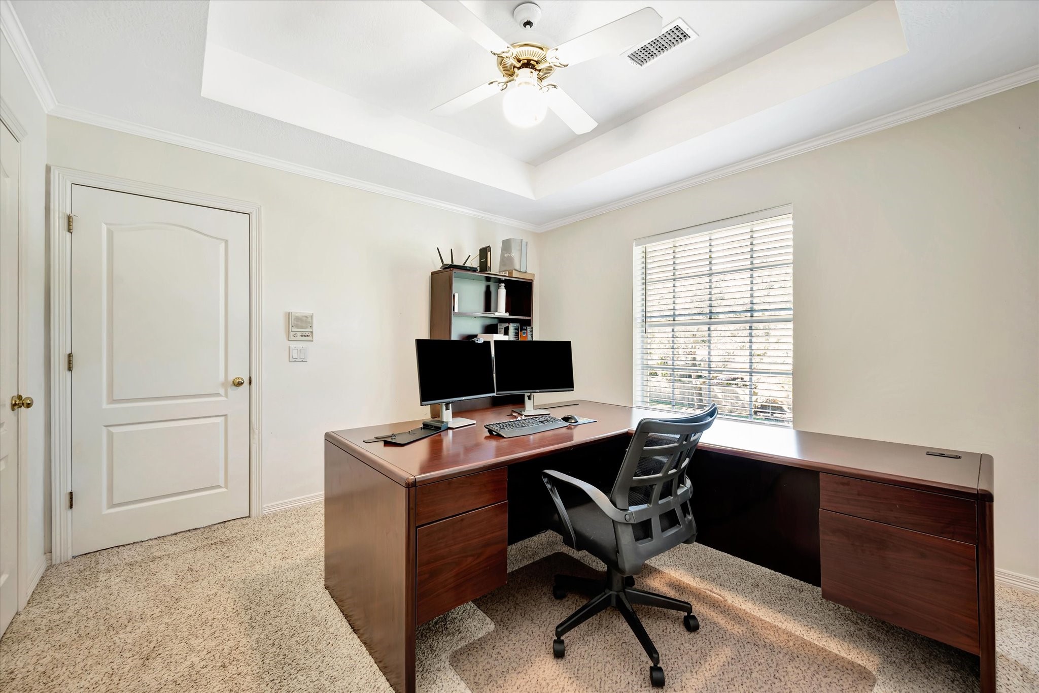 14934 Wilderness Cliff Court Houston, TX 77062 - Photo 50 of 50 a view of a workspace with furniture and a window