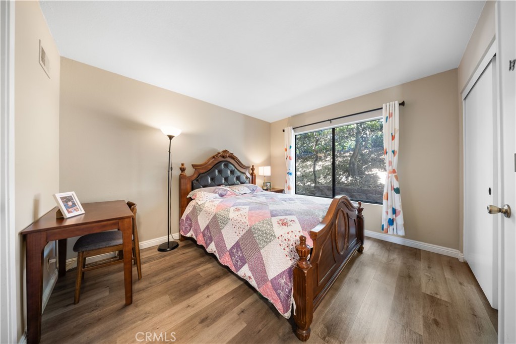11 Palos, Unit 55 Irvine, CA 92612 - Photo 13 of 25 a bedroom with a bed and a window