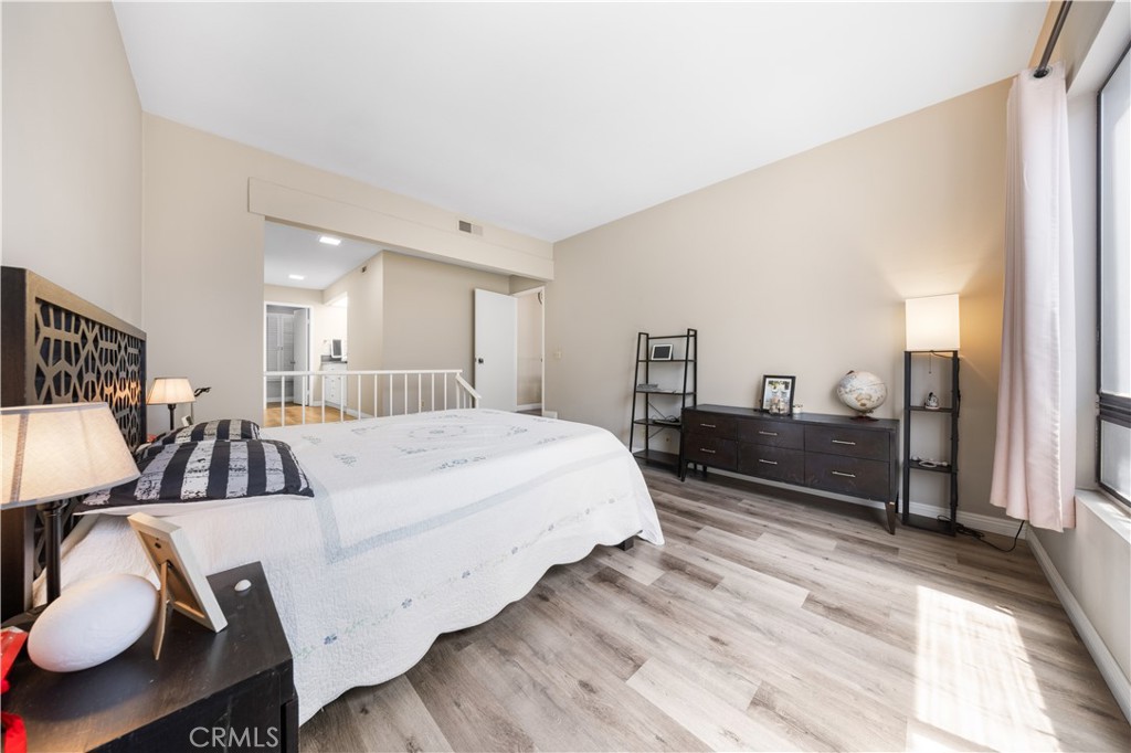 11 Palos, Unit 55 Irvine, CA 92612 - Photo 17 of 25 a bed room with a bed and dresser